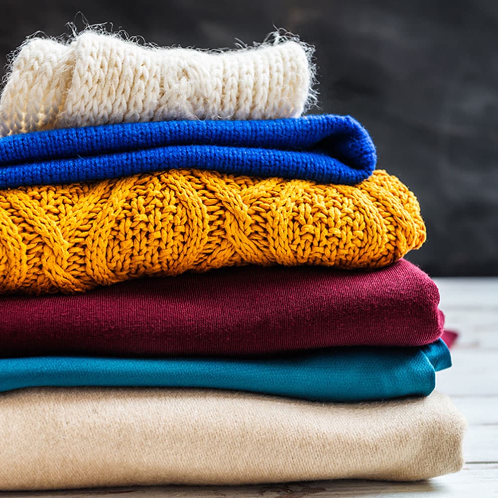 Stack of knit sweaters