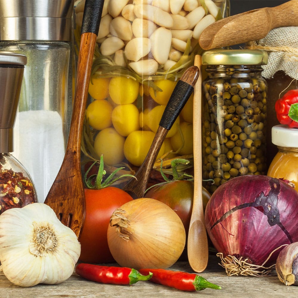 Fresh food, jarred food, and kitchen utensils
