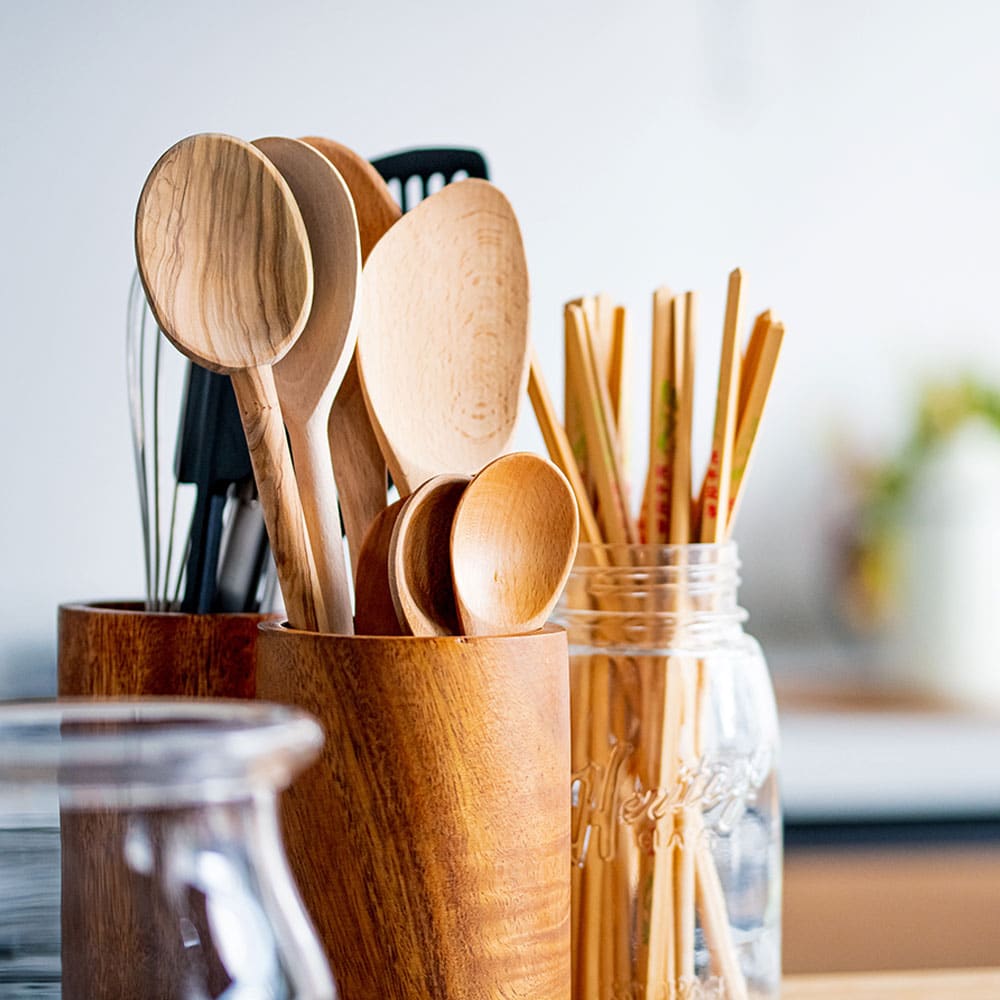Multiple containers of kitchen utensils